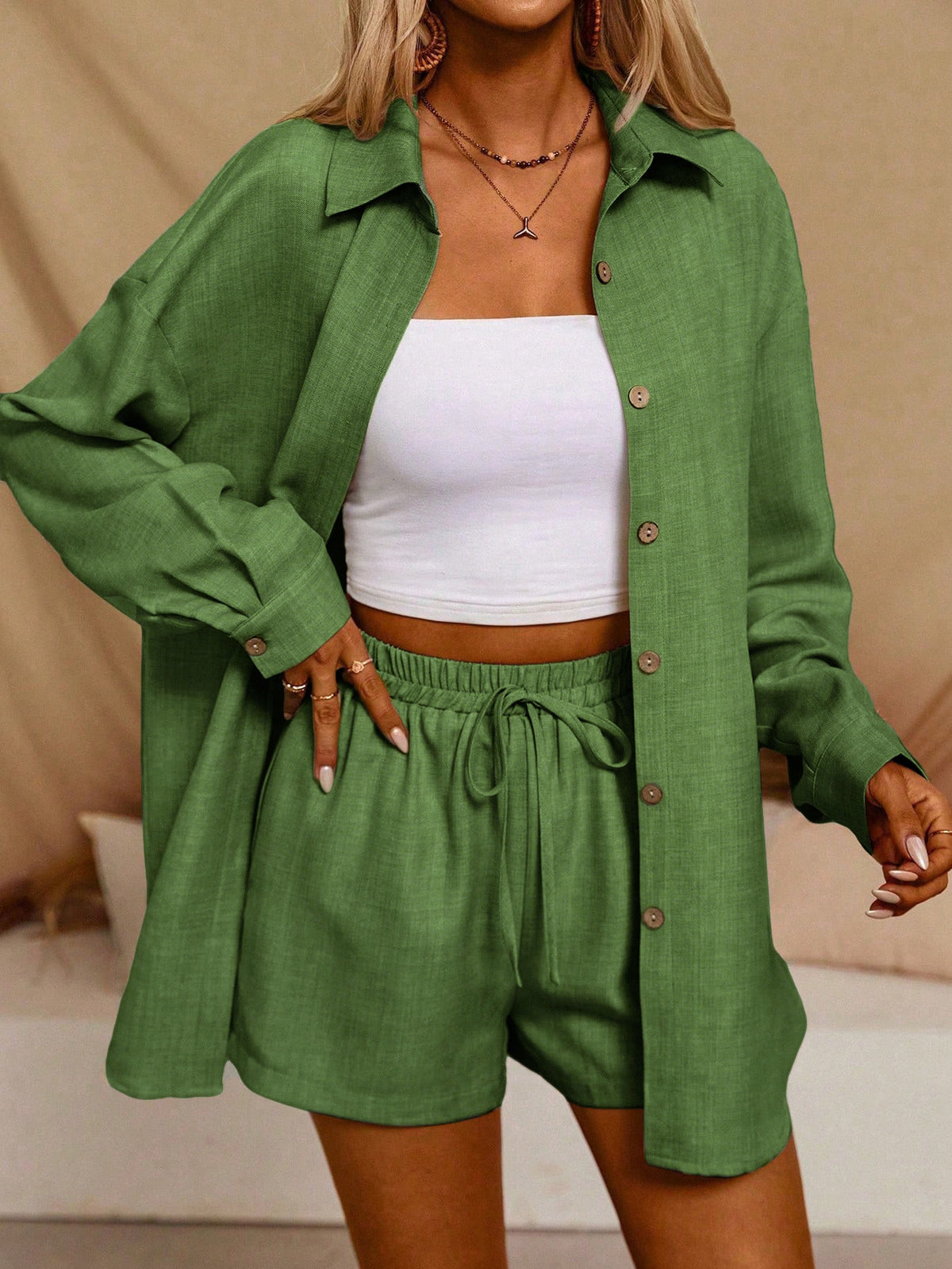 A Casual Two-Piece Set Long-Sleeve Button-Up Shirt with an Elastic Waist, Along with Loose Wide-Leg Trousers