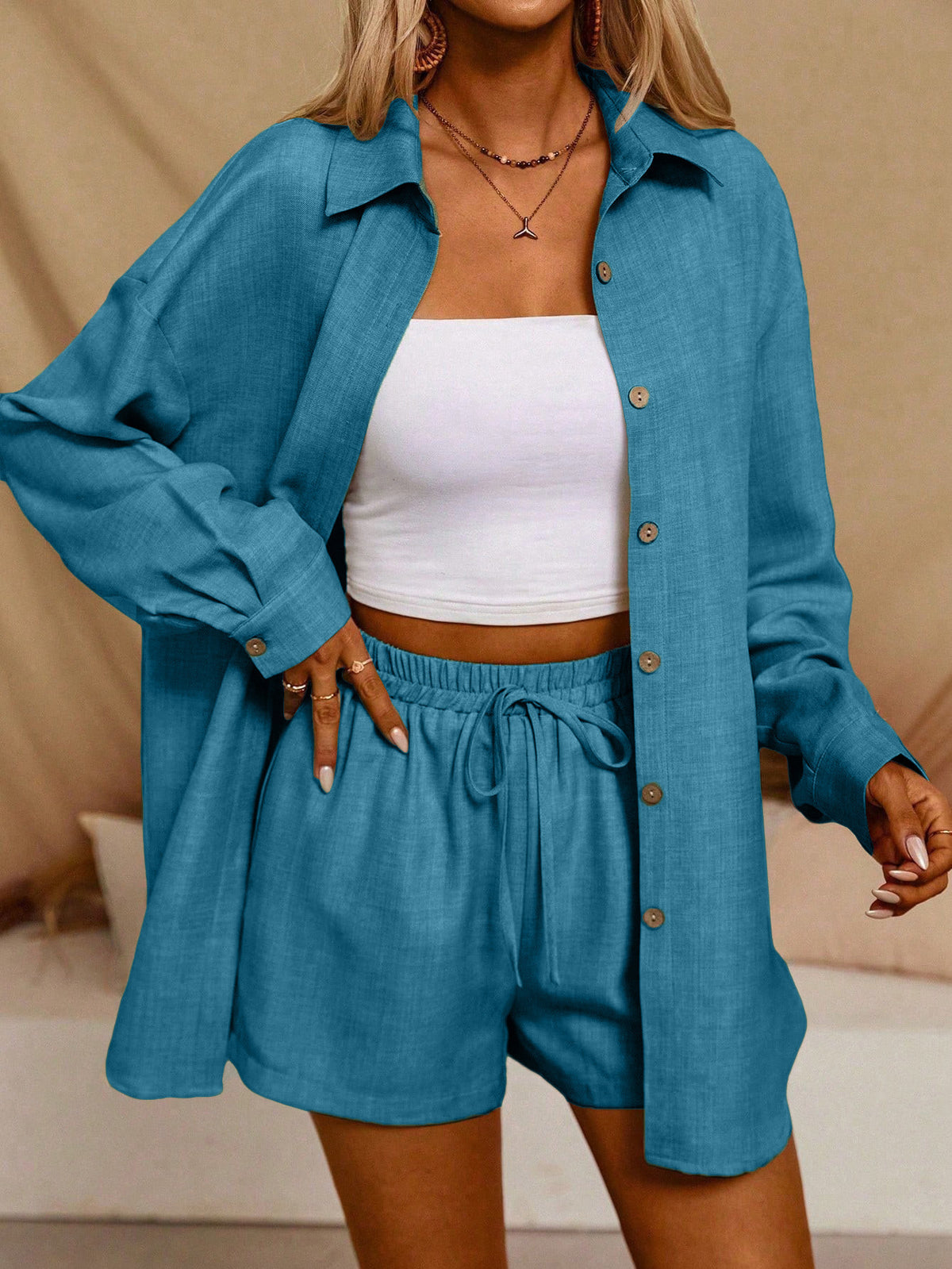 A Casual Two-Piece Set Long-Sleeve Button-Up Shirt with an Elastic Waist, Along with Loose Wide-Leg Trousers