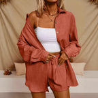 A Casual Two-Piece Set Long-Sleeve Button-Up Shirt with an Elastic Waist, Along with Loose Wide-Leg Trousers